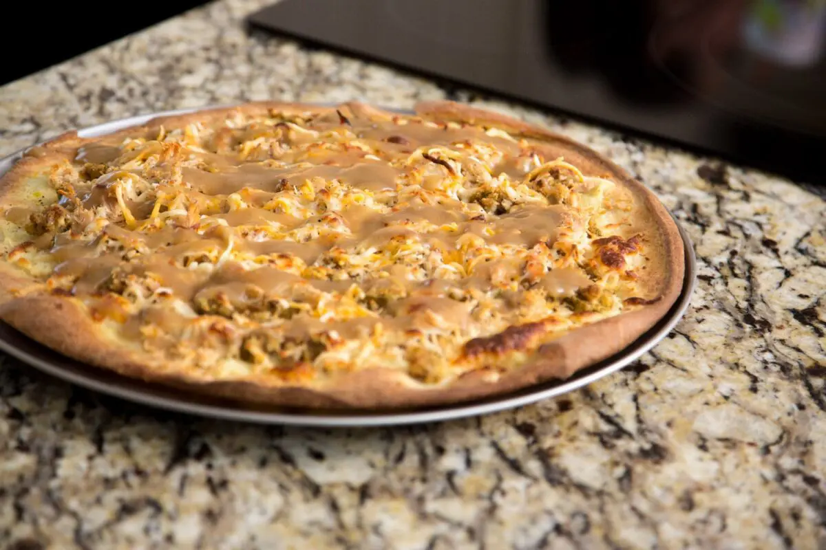 pilgrim pie pizza, baked and ready to be served with your holiday leftovers