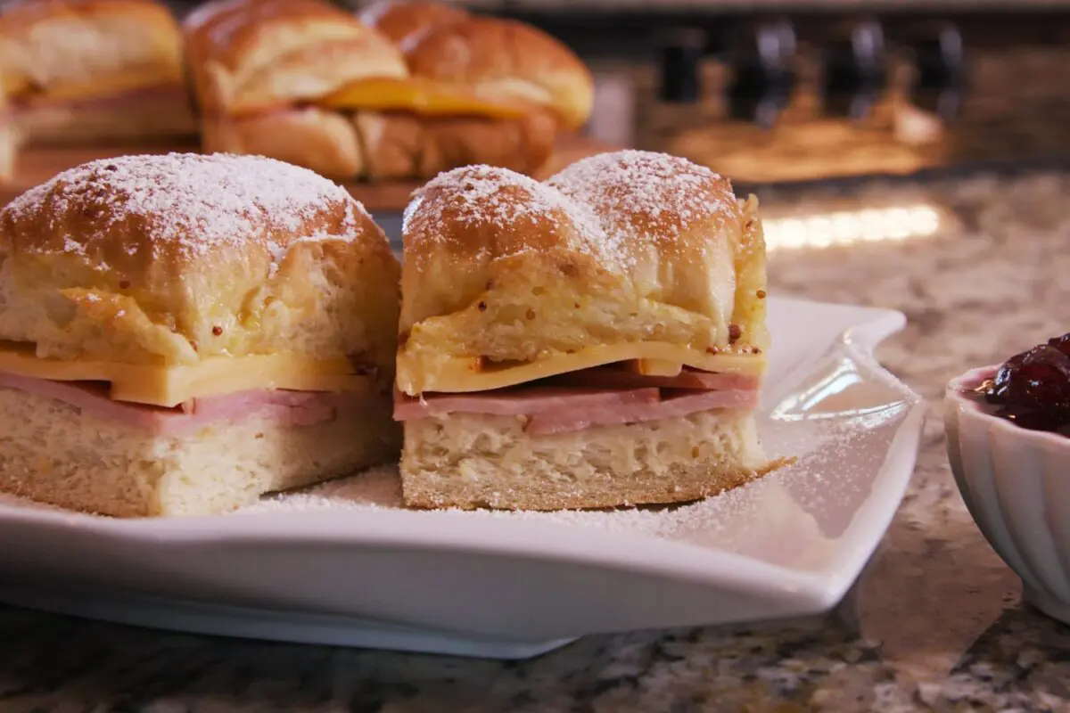 Monte Cristo Sliders served on a plate complete with raspberry jelly.