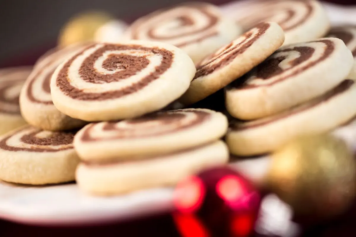 Chocolate Pinwheel Cookies stacked and ready to be given as Christmas gifts