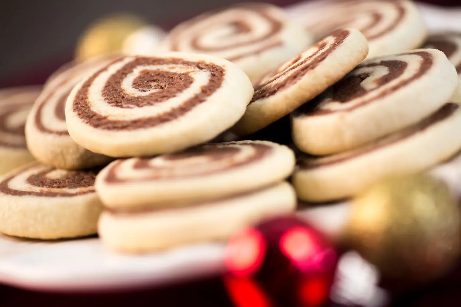 Chocolate Pinwheel Cookies stacked and ready to be given as Christmas gifts