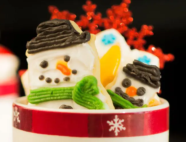 Homemade holiday snowman sugar cookies stuffed in a cozy mug