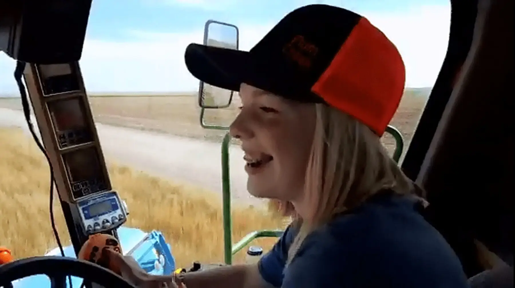 Amaya Ochs is a young farmer driving her family's combine.