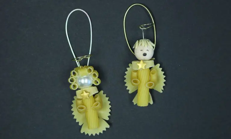 DIY Pasta angels created with wheat pasta, pearls and wire halos ready to hang on the tree