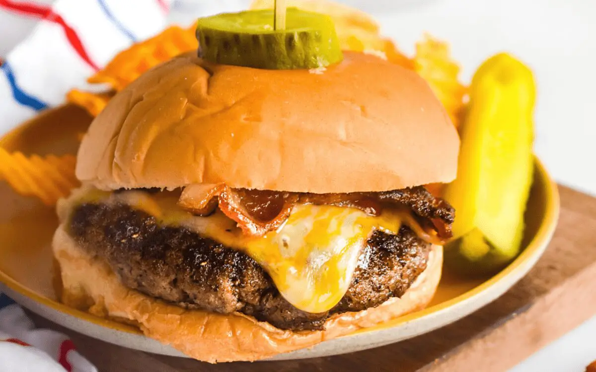 Photo: Bacon Cheeseburgers at a summer cookout.