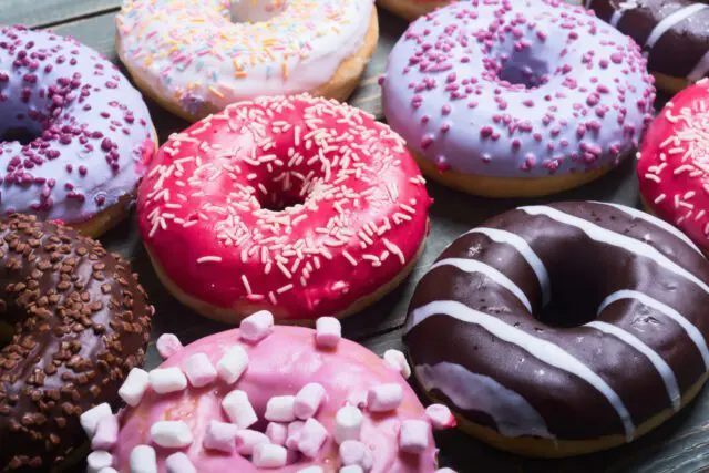 Colorful donuts arranged on a plate to celebrate National Donut Day