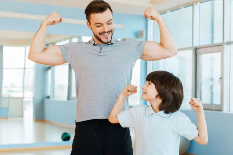 Photo: Man and boy with strong and healthy bodies.