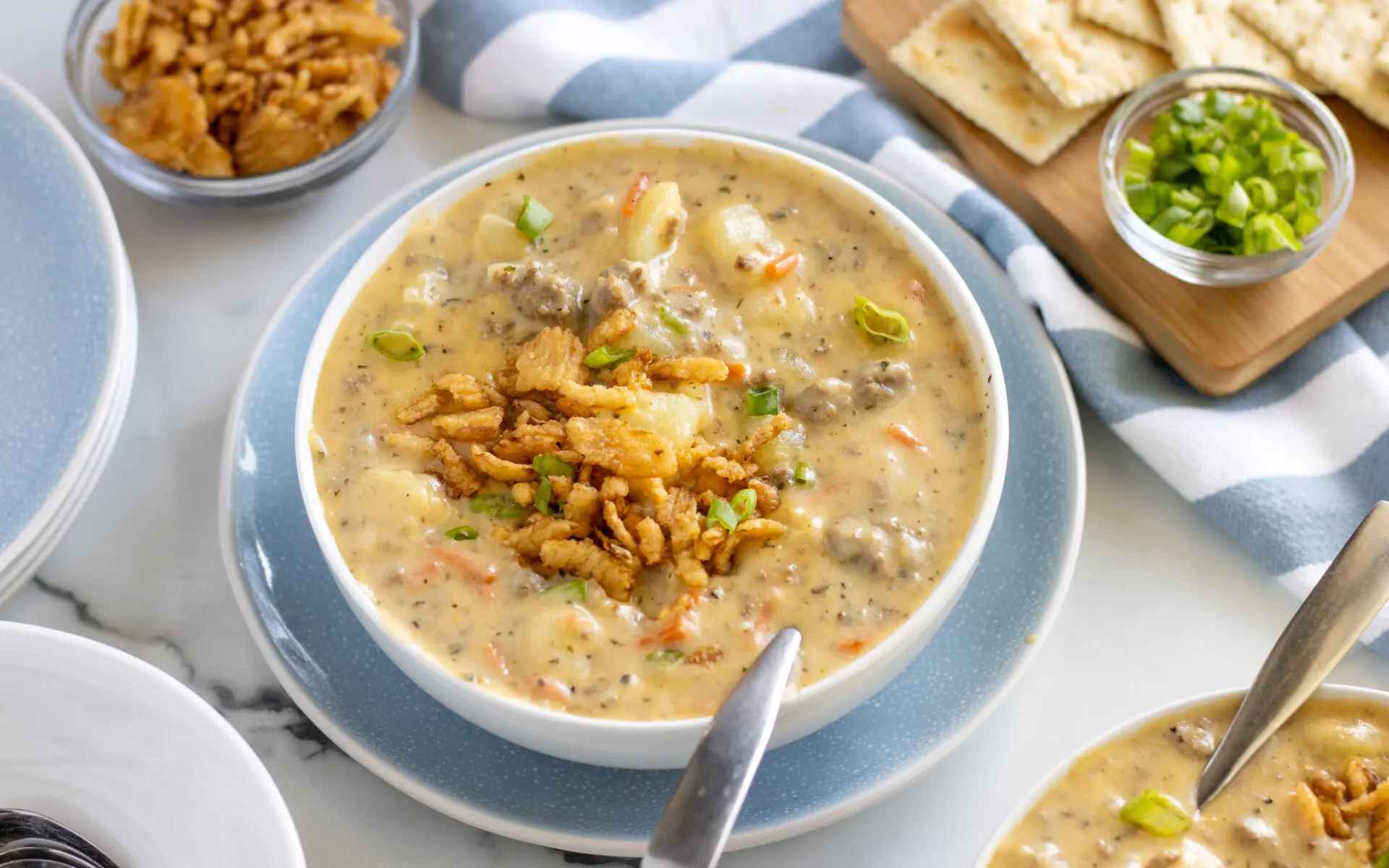 Cheeseburger Soup Web | Eat Wheat Cheeseburger soup in a bowl on a table.
