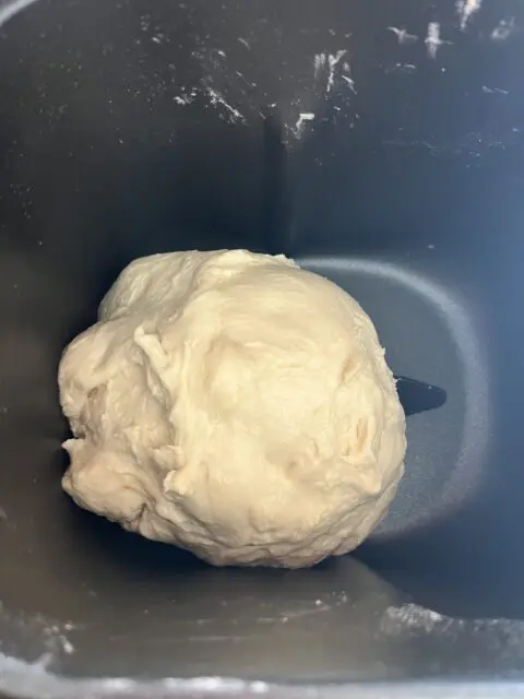 Bread Machine English Muffins dough in the bread machine ready for its next cycle. 