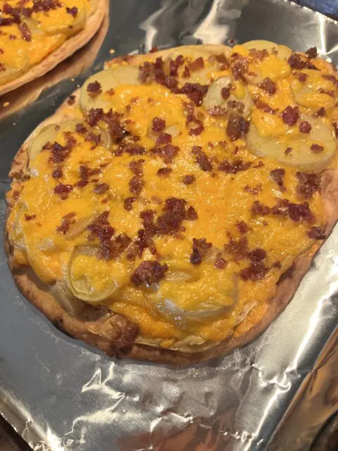 Loaded Potato Naan Pizza after being cooked in the oven. 