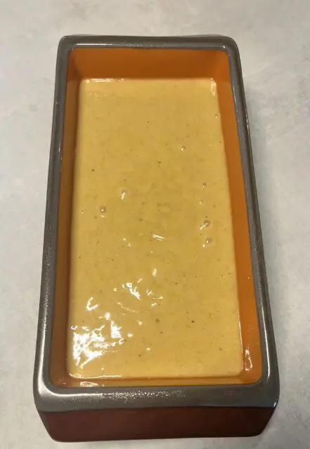 Honey spice bread batter poured into the prepared baking pan. 