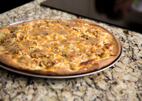 pilgrim pie pizza, baked and ready to be served with your holiday leftovers