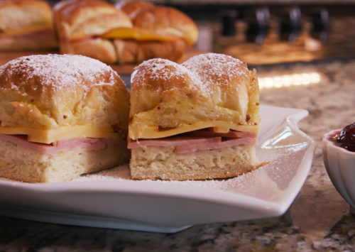 Monte Cristo Sliders served on a plate complete with raspberry jelly.