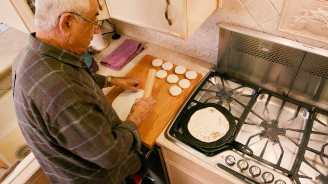 Tony rolling tortillas