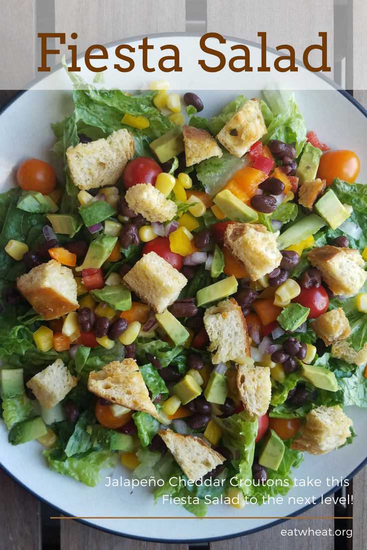This Fiesta Lettuce Salad features a rainbow of veggies with Jalapeño Cheddar Croutons and a salsa-ranch dressing and is sure to be a family favorite! eatwheat.org