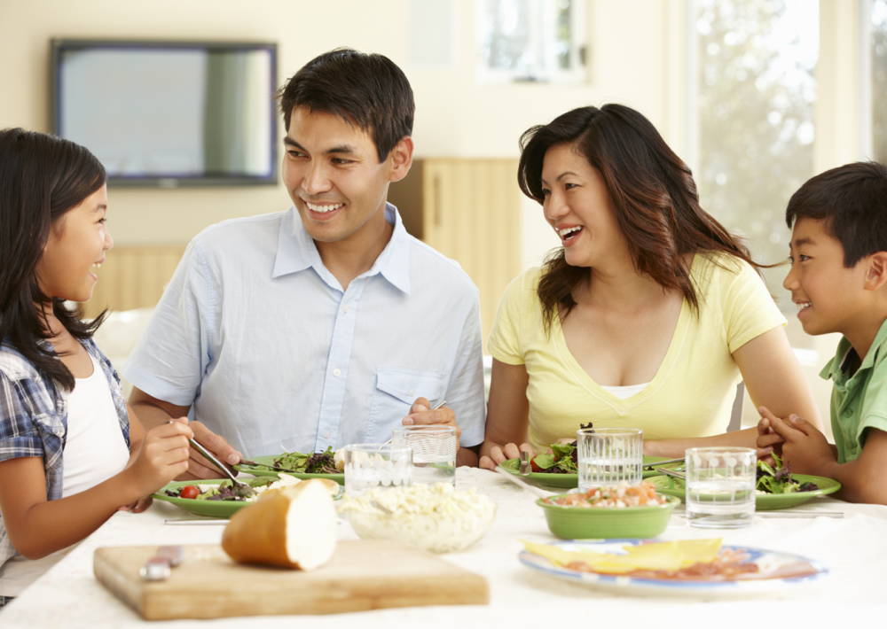 Family eating meal together. Eat Better. Eat Together.