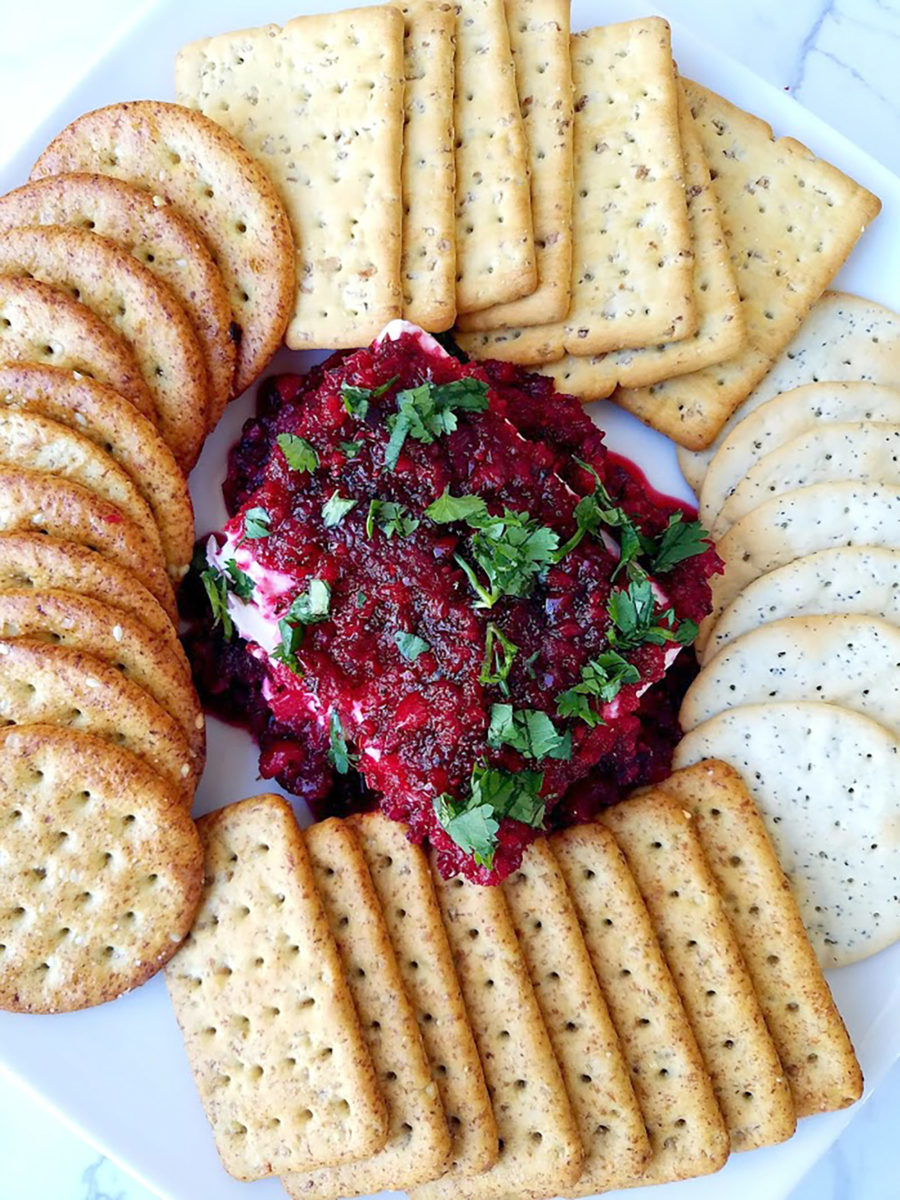 Looking for a festive appetizer this holiday season? Look no further than this Cranberry Jalapeño Salsa served over cream cheese. Serve with assorted crackers and guests will literally be digging into this tasty dip.