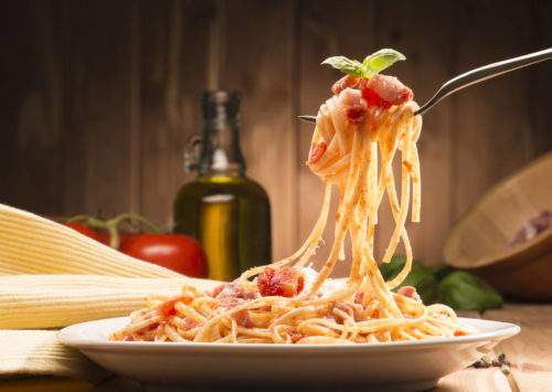 spaghetti with red sauce on fork