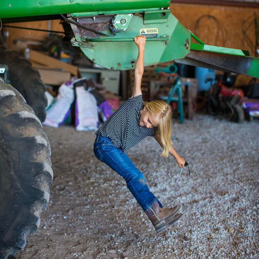 Photo: Burgess daughter playing on combine.